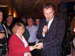 John Leslie presents 1st prize in the raffle to Susan Fletcher