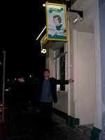 Stuart Donald underneath God outside the Cabbage & Ribs