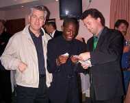 Stuart Donald bribes Russel into playing for London Hibs while John Smith looks on