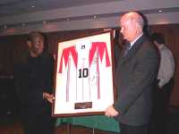 Russel Latapy presents his International shirt to the Hibs Supporters Association